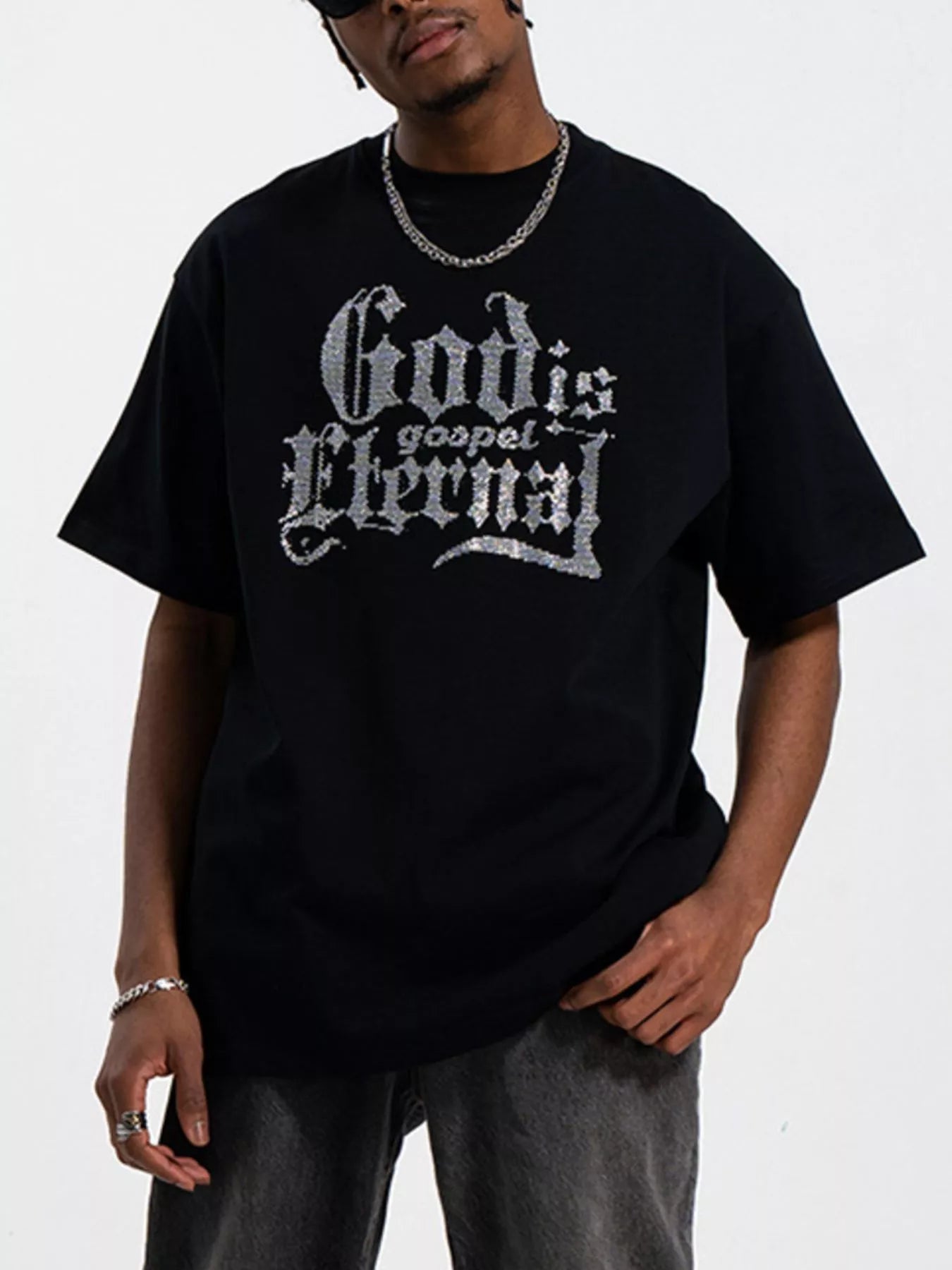 Men's black short sleeve round neck t-shirt with lettering on the front.