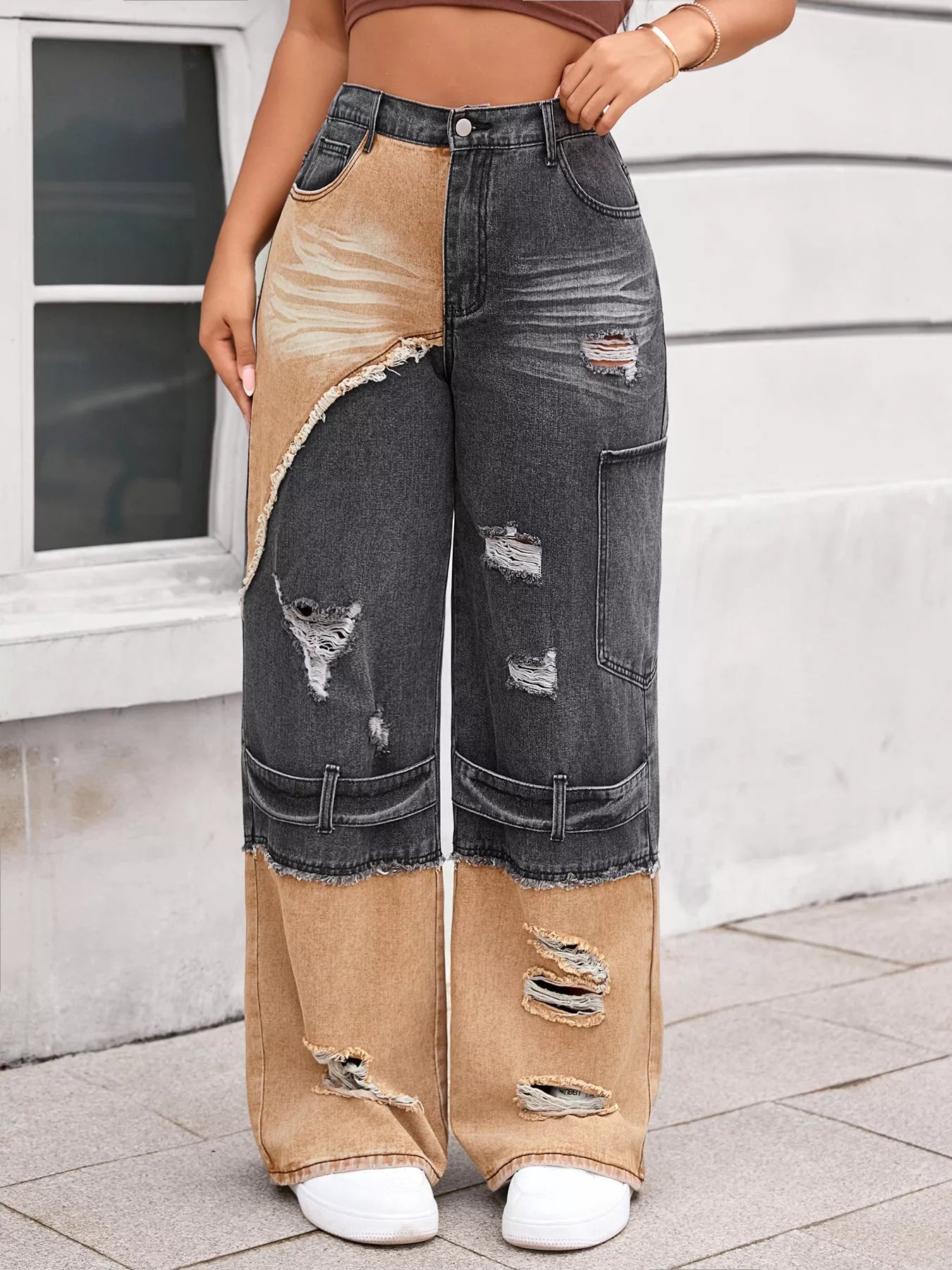 Two-tone wide leg jeans with ripped detailing.