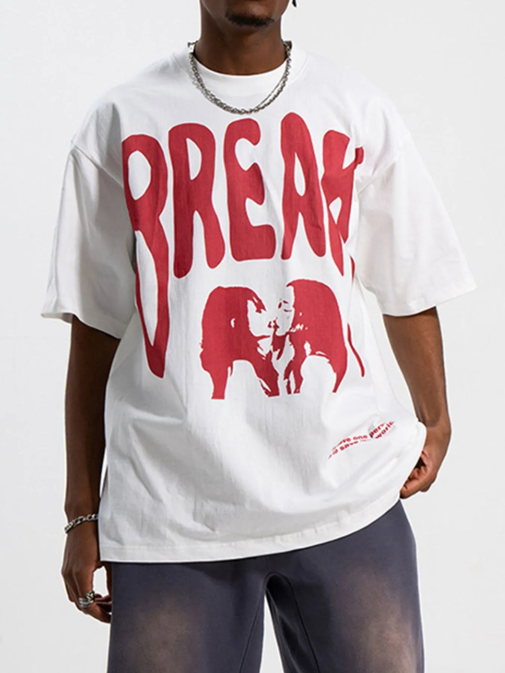 Men's oversized white round neck t-shirt with a front graphic print.